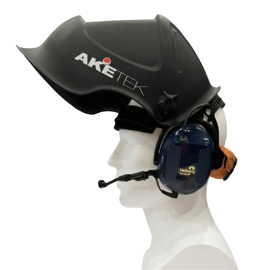 AKETEK® AUDIO welding helmet raised, worn with communication earmuffs and microphone